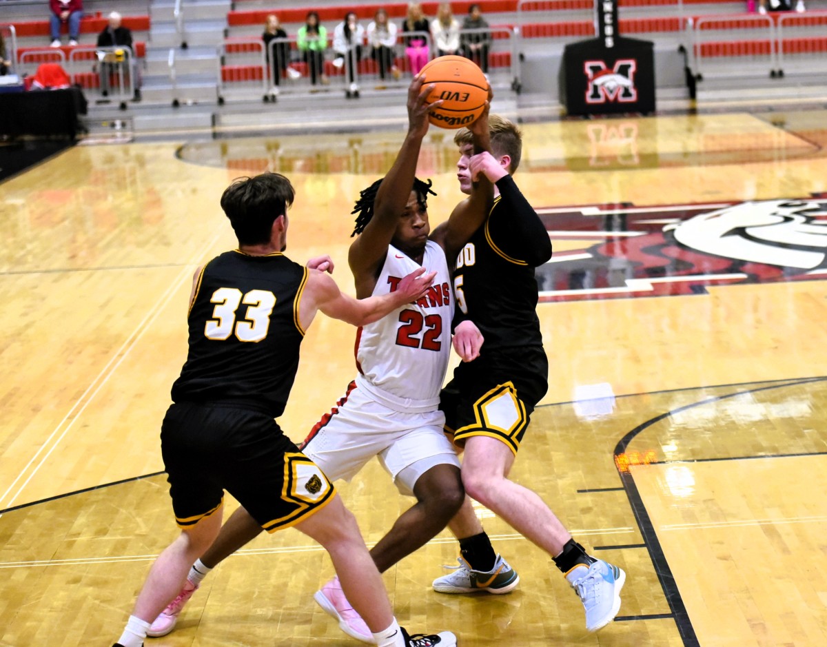 Midwest City Carl Albert senior Quincy Hopkins (22) makes a drive toward the basket during a recent game.